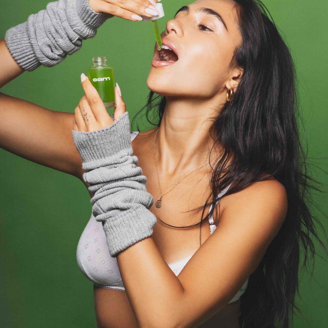 Roxy applying the check drops into her mouth.