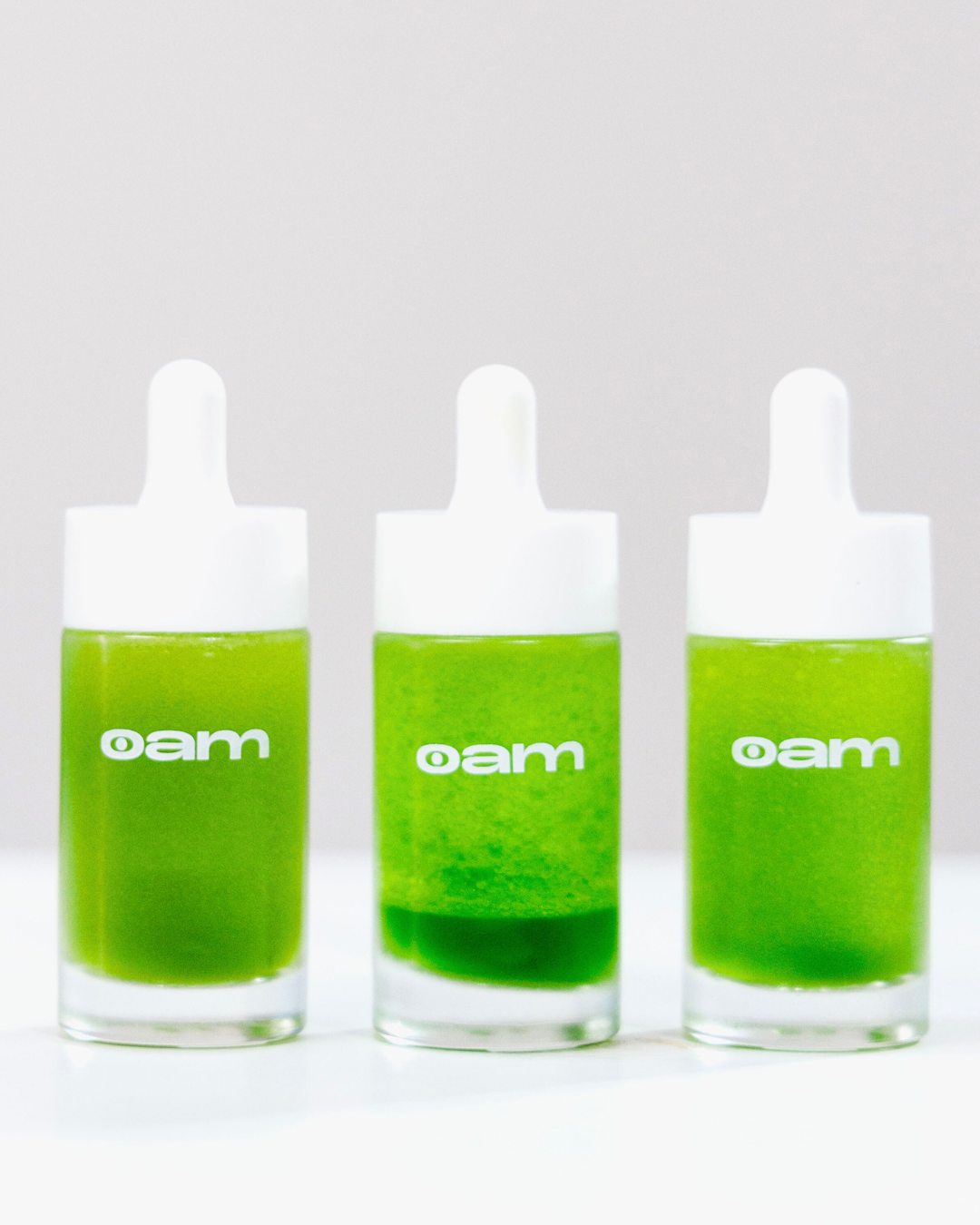 Three bottles of eyeam's hormone check drops lined up.